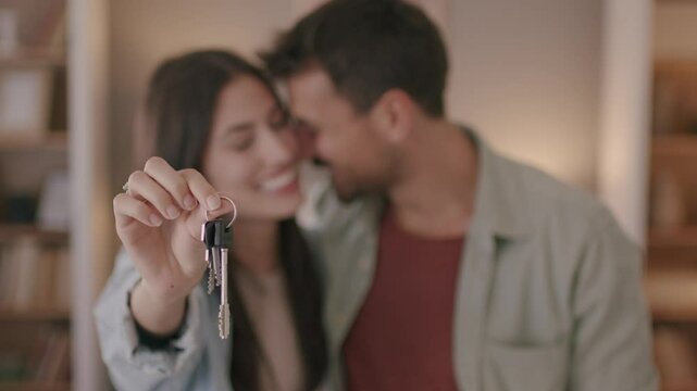 Love, keys and excited with couple in new house for moving, real estate and investment, 4k video