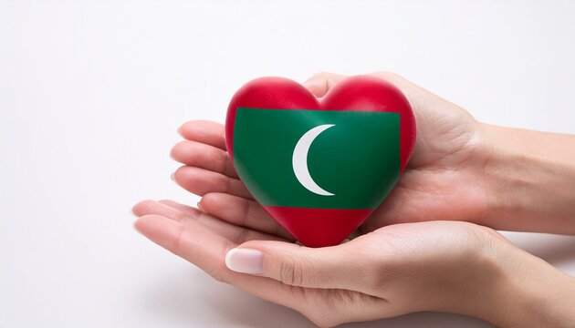 手で持っているモルディブの国旗のハート(Heart of Maldives flag held in hand.)
