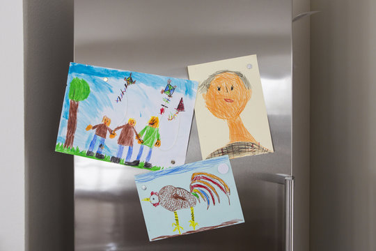 Child's drawings fixed at fridge