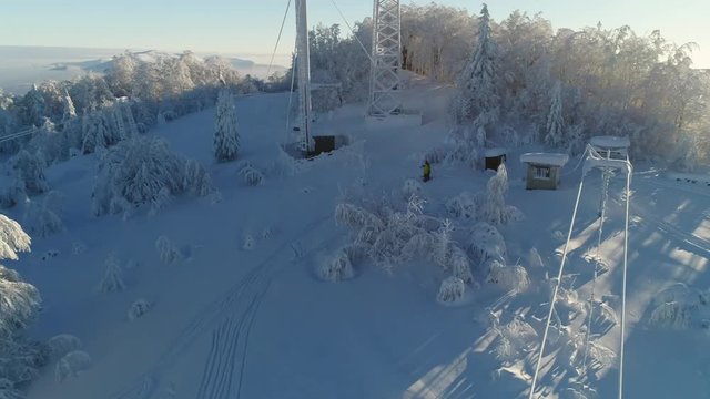 Epic Aerial Shot: Beautiful Winter Aerial Flight Over Mountains. Ski Vacation Travel. 4k