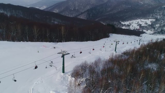 Epic Aerial Shot: Beautiful Winter Aerial Flight Over Mountains. Ski Vacation Travel. 4k