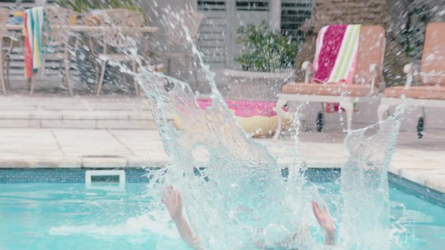 happy woman jumping in swimming pool on warm summer day splashing enjoying summertime having fun summer vacation 4k footage