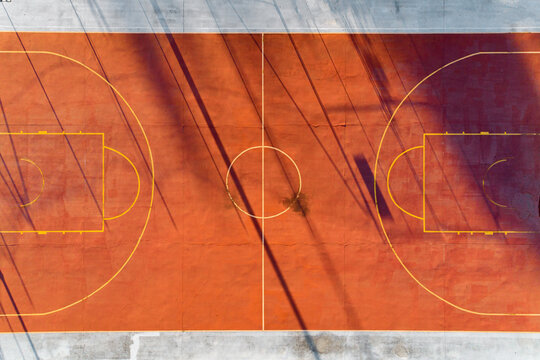 Aerial views over urban basketball and tennis sports hardcourts