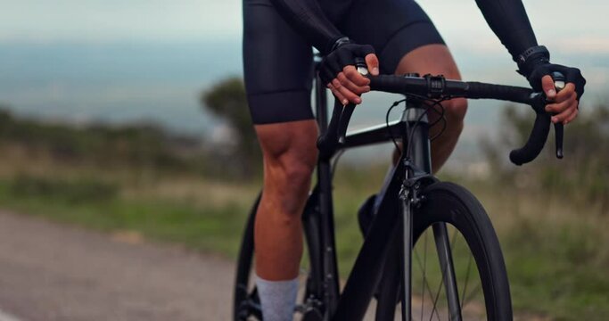 Active male cyclist riding black sports professional bicycle