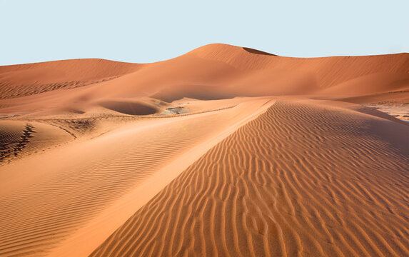 Panoramic view of orange sand dune desert with clear blue sky at Namib desert - Namibia