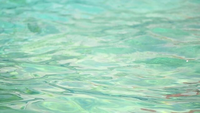 Slow motion footage of clean swimming pool water as background