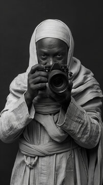 priest in the holy father takes photos with a camera in the church