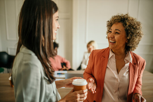 Shot of two beautiful businesswomen sharing ideas during a meeting in the office