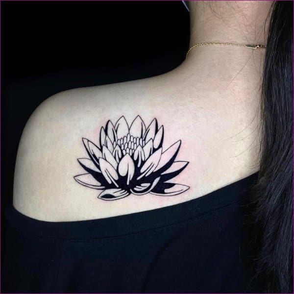 tribal lotus tattoo back of neck