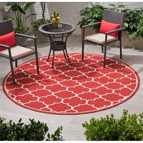 Round shaped rugs soften a square angular space. Johncarlo Outdoor 7'10" Round Trefoil Area Rug, Red and ...