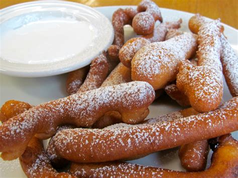 Not to be confused with funnel cakes, elephant ears also originated in america. fried dough vs funnel cake