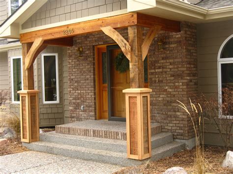 Covered porch with wood flooring painted black. Front Porch Cedar Columns — Randolph Indoor and Outdoor Design