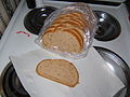 A loaf of rye bread in a plastic bag