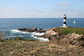 El faro de Ribadeo con barquito velero