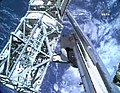 The Canadarm moves the P3/4 Truss out of the Space Shuttle