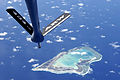 A boom from a KC-135 Stratotanker over Wake island in the pacific