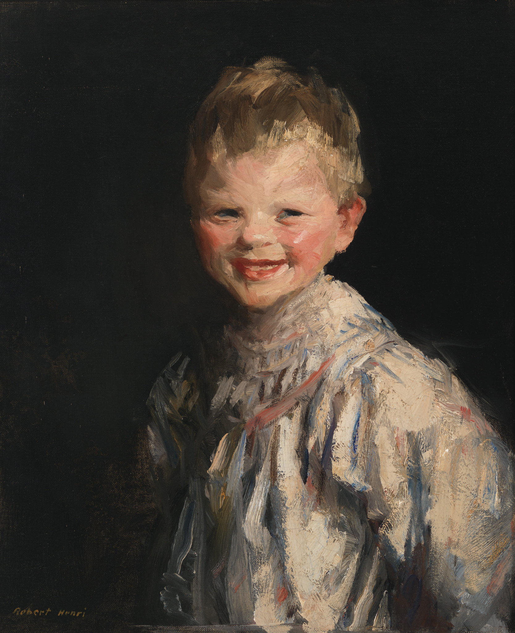 Oil painting of a smiling young child with rosy cheeks and tousled hair, set against a dark background. The child is wearing a light-colored garment with hints of blue and red, and the artist's signature, "Robert Henri," is visible in the lower left corner.