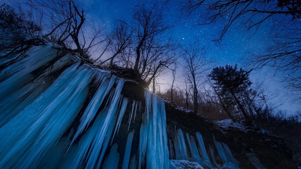 Frozen waterfall icicles at night with stars, Matsumoto, Nagano, Japan