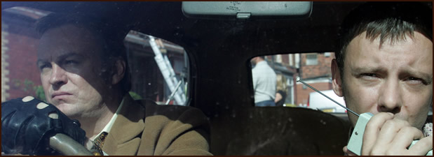 Actors in a scene in a car.