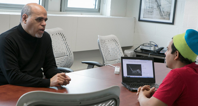 Student and faculty talking 