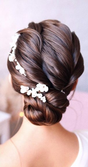 Updo Hairstyles For Your Stylish Looks In 2021 : Elegant Twisted Low Bun