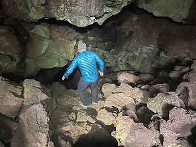 Scrambling down into the lave river cave