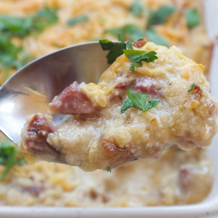 baked grits with cheese in white pan