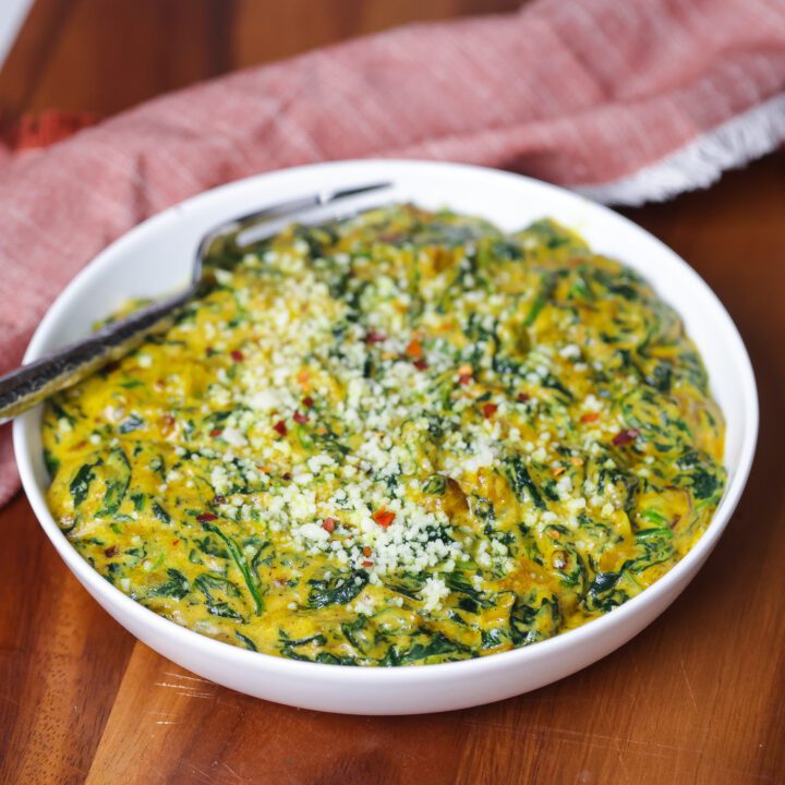 creamed spinach in white bowl