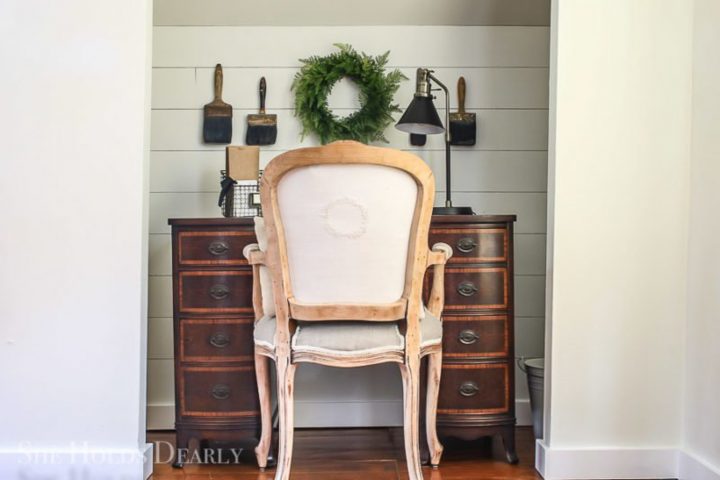 Wood desk with a chair in a closet