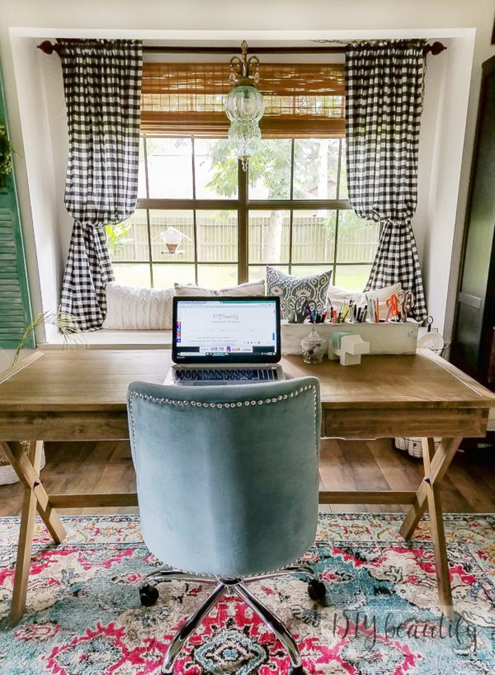 Wood desk facing the window