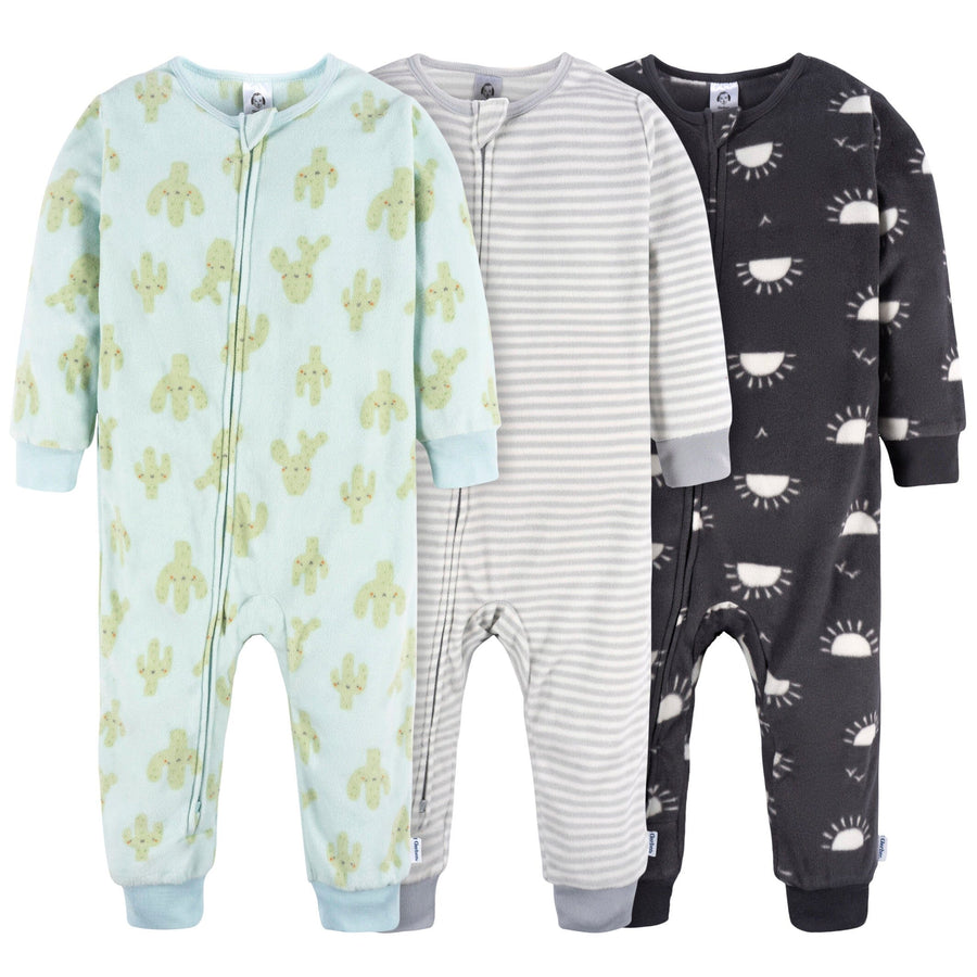 Three infant and toddler fleece pajamas featuring a neutral cactus print, perfect for cozy and stylish sleepwear