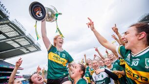 <p>Kerry's Louise Ni Mhuircheartaigh is lifted up by teammates after winning the 2024 All-Ireland title. Picture: ©INPHO/Tom Maher</p>