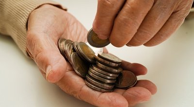 Retired,Elderly,Woman,Counting,Coins,Money,And,Worry,About,Monthly