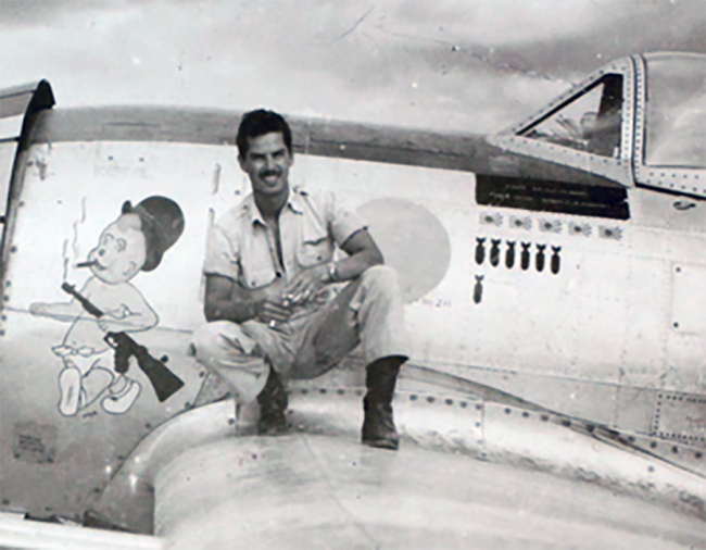 Oscar Perdomo on the wing of his P-47. 