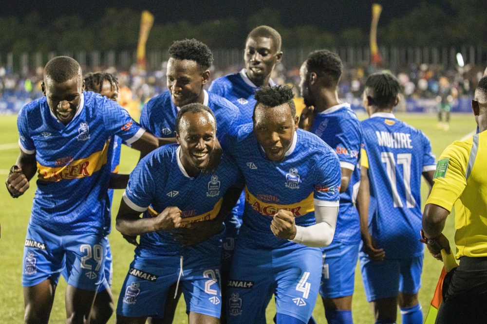 Rayon Sports players join goalscorer Olivier Niyonzima in celebration after scoring in club&#039;s 2-1 win over Muhazi United at Kigali Stadium on Wednesday, December 4-Photo by Emmanuel Dushimimana