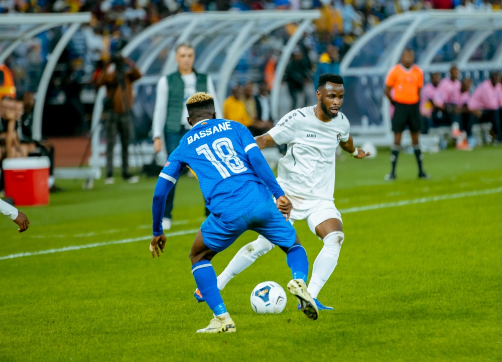 Rayon Sports striker Aziz Bassane (R) takes on APR&#039;s Gilbert Mugisha during the game on Saturday, December 6.