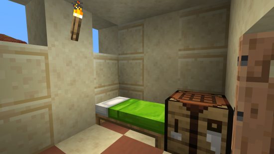 How to build a Minecraft village: a lime green bed inside a desert village house.