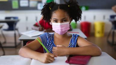 Girl wearing mask at school