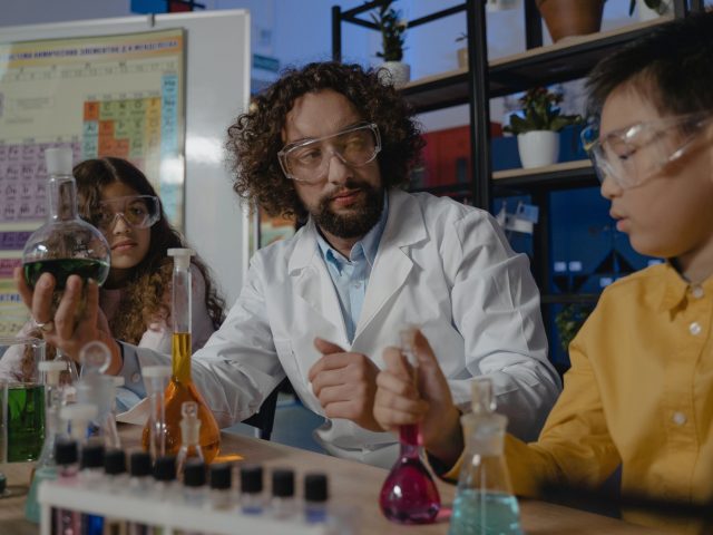 Science teacher demonstrating experiment