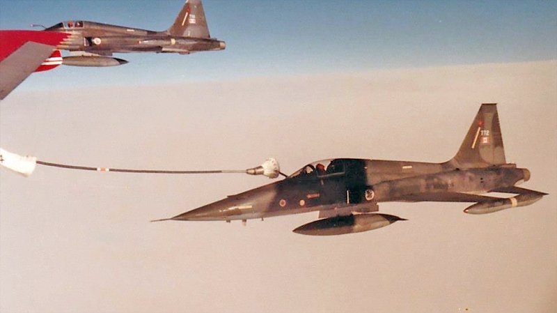 CF-5 refuels from a 707 tanker.