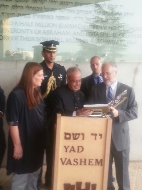 President Mukherjee was presented with a copy of the Yad Vashem Album, "To Bear Witness"