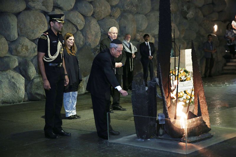 The President rekindled the eternal flame at a special memorial ceremony held in the Hall of Remembrance