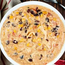 Fantastic and easy Crock Pot Cream Cheese Chicken Chili recipe in a white bowl.