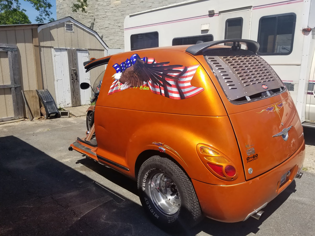 American falg bald eagle large graphic sticker on side of custom orange pt cruiser. 