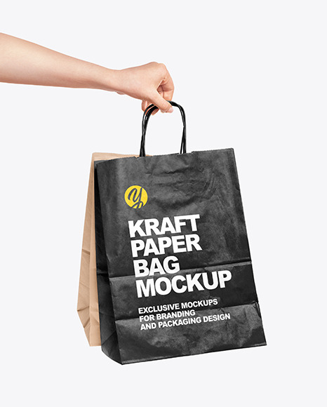 Download Hand Holding a Paper Bag Mockup in Packaging Mockups on ...